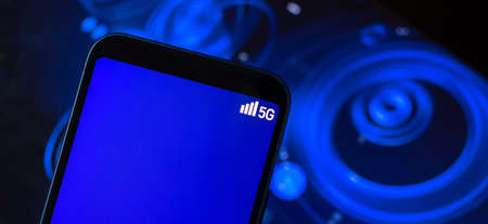 Mobile phone connected to 5G network wireless system. Banner, concept of high speed mobile internet, new generation networksの写真素材