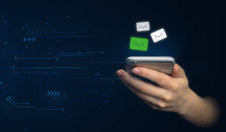 E-mail and social media. Hand using smartphone with new messages icon. Business and marketing...