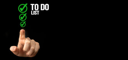 To do list with checklist boxes. Hand marking check list on a black background, banner