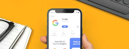 Kharkov, Ukraine - January 10, 2022: Google app icon closeup, banner design. Woman uses the...