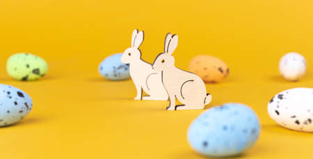 Happy easter greetings with decorated eggs and rabbits, banner. celebration background. spring holiday conceptの写真素材