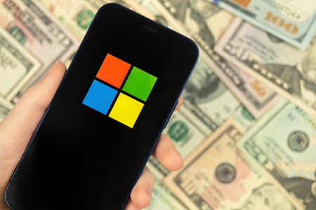 Kharkov, Ukraine - January 19, 2021: Microsoft . Smartphone with company icon. business background,...