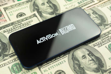 Kharkov, Ukraine - January 19, 2021: Activision Blizzard and money. closeup. Business, stock trade, video game companyのeditorial素材
