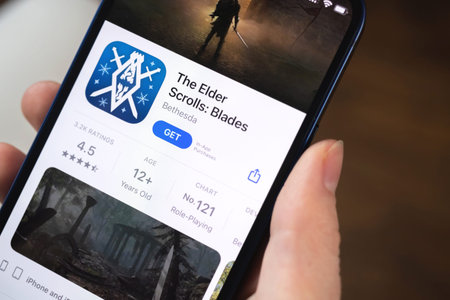 Kharkov, Ukraine - January 19, 2022: The Elder Scrolls Blades game app. Girl holding mobile phone...