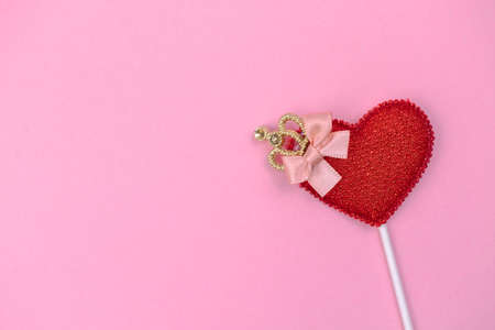Valentine day greeting concept with red heart decoration on bright pink background top view, copy space. flat layの写真素材