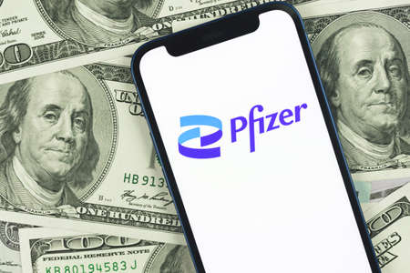 Kharkov, Ukraine - January 27, 2022: Phizer , vaccine and vaccination, immunization concept. Background of the money, businessのeditorial素材