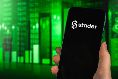 Kharkov, Ukraine - January 27, 2022: Stader token green stock chart background, cryptocurrency...