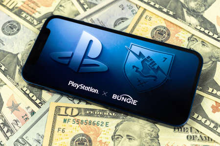 Kharkov, Ukraine - January 31, 2021: Sony buying Bungie video game studio. closeup. Web news background with moneyのeditorial素材