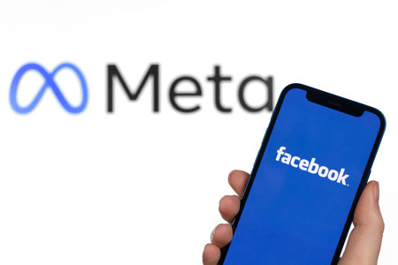 Facebook change name in Meta. on mobile phone screen. metaverse concept photo