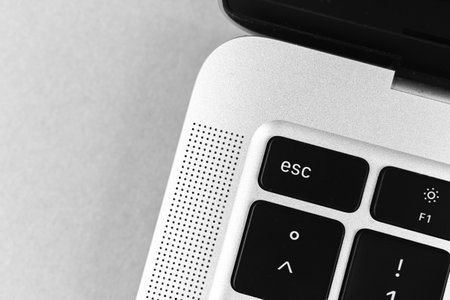 Esc key and button on keyboard. Escape sign close-up. Modern laptop, communication conceptの写真素材