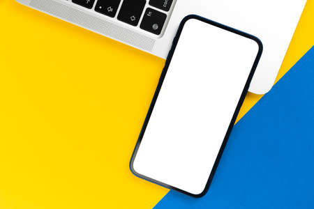 Office desk with smartphone mockup screen. Business flat lay and minimal design background. top view and copy spaceの写真素材