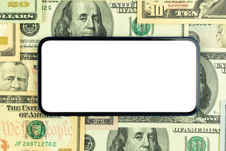 Business smartphone mockup. Office desktop with money dollar bills background, top view, copy spaceの写真素材