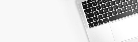 Modern laptop keyboard flat lay white banner background. Office workplace table, minimal design...