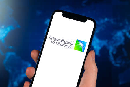 Saudi Aramco stock trade on the globe background. Arabian oil company, gas industry. finance market concept photoのeditorial素材