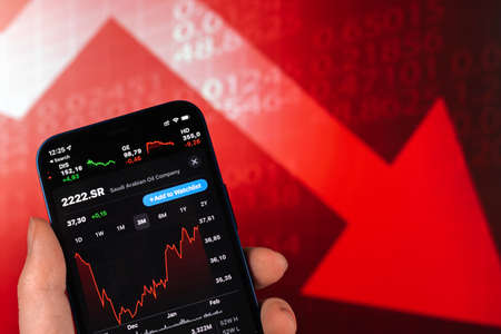Kharkov, Ukraine - February 11, 2022: Saudi Aramco stock trade on red chart. Arabian oil company, gas industry. finance market backgroundのeditorial素材