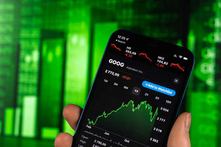 Kharkov, Ukraine - February 11, 2022: Alphabet Inc stock trade on green chart. Google company, technology industry. finance market backgroundのeditorial素材