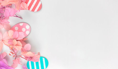 Colorful easter eggs and flowers. Border design with pink spring flowers. Happy easter greetings...