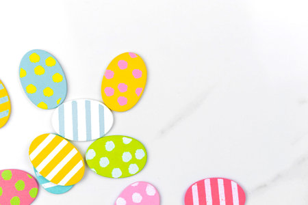 Colorful easter eggs. Holiday decoration background with copy space, flat lay, top view