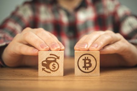 Bitcoin and exchange rate concept background, us taxation. Wooden cubes with bitcoin and percent...