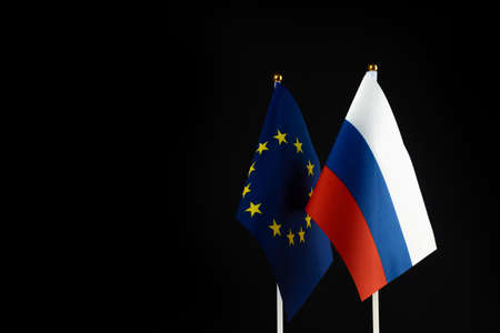 EU and Russia flags on black background. Sanctions pressure, politics concept photo. Europe union vs Russia. copy spaceの写真素材