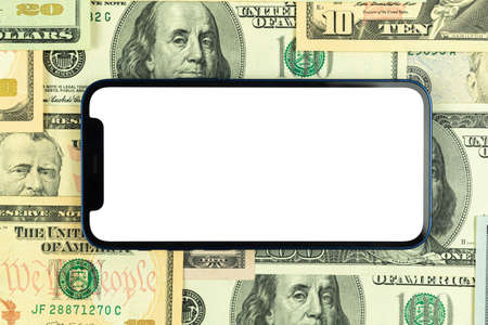 Flat lay Apple iPhone horizontally screen mockup, business office desktop with money and dollar bills background. Top view, copy space photoのeditorial素材