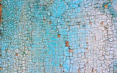 Old wood texture with colorful cracked paint. Retro and vintage high detailed background, close-up viewの写真素材