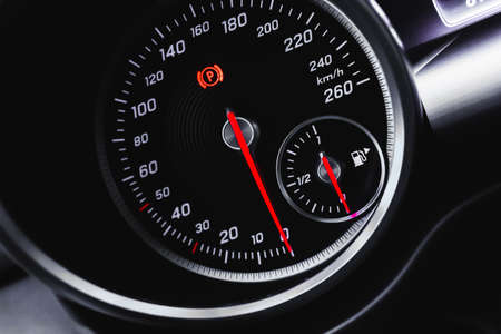 Car speedometer, luxury dashboard with glowing indicators close-up view, backgroundの写真素材