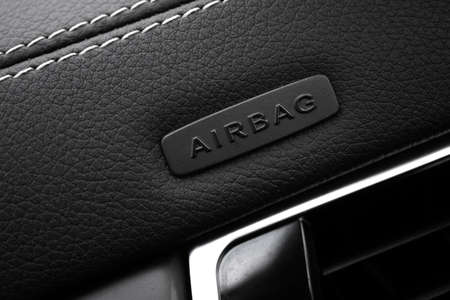 Safety airbag sign on car, luxury sport car interior background photoの写真素材