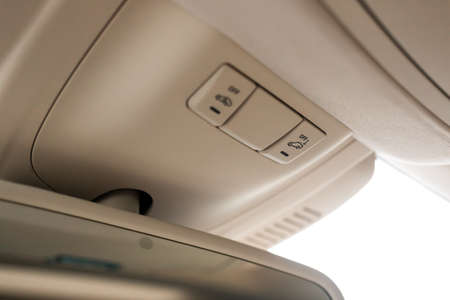 Closeup of cabin lights switch in car, light control panel inside a car interior. For reading etc.の写真素材