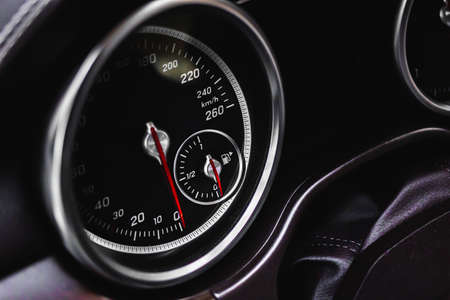 Speedometer at dashboard of luxury sport car, close-up view, vehicle wallpaper and backgroundの写真素材