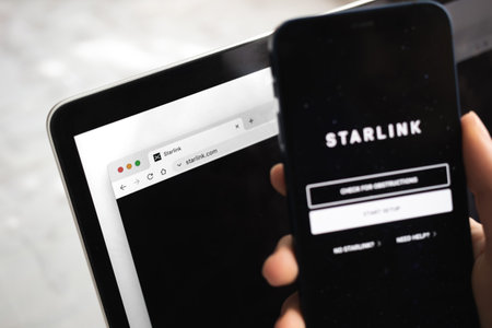 Poltava, Ukraine - March 26, 2022: Starlink Internet. Mobile phone with logo close-up viewのeditorial素材