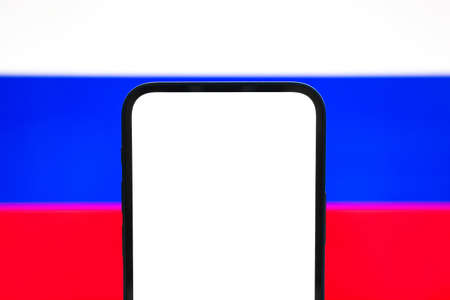Half mobile phone screen mockup on Russian flag background. Mockup for text, application info etc., copy spaceの写真素材