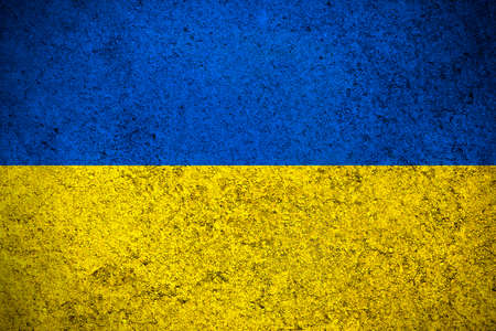 Ukraine flag, grunge texture background photo. National country flag painted on concrete wallの写真素材