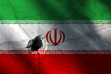 Iran flag with big crack or bullet hole. Military conflict and war in country concept background photoの写真素材