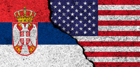USA and Serbia. Flags painted on cracked concrete wall. United States, America. Partnership, relationships and conflict concept. banner backgroundの写真素材