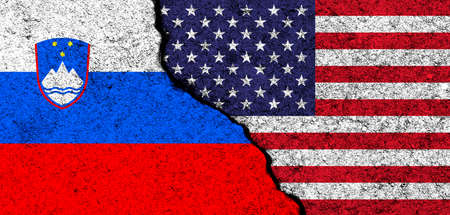 USA and Slovenia. Flags painted on cracked concrete wall. United States, America. Partnership, relationships and conflict concept. banner backgroundの写真素材