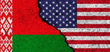 USA and Belarus. Flags painted on cracked concrete wall. United States, America. Partnership, relationships and conflict concept. banner backgroundの写真素材