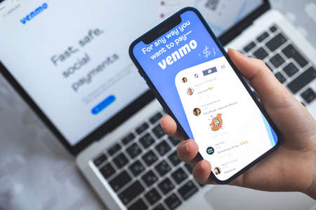 Woman use Venmo app. Mobile phone banking and investment conceptのeditorial素材