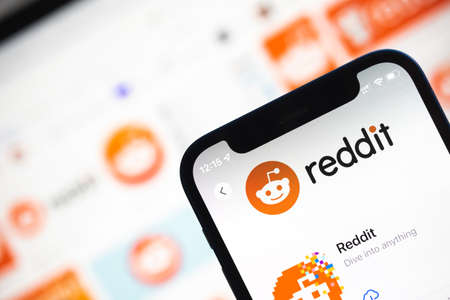 Reddit displayed on a smartphone device close-up view photoのeditorial素材