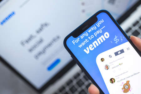 Woman use Venmo app. Mobile phone banking and investment conceptのeditorial素材