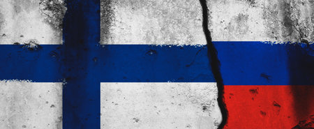 Finland vs Russia. Military conflict and war banner. Flags background painted on concrete wall with crack photoの写真素材