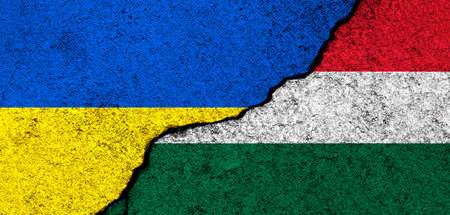 Ukraine and Hungary flags. Support and help, weapons and military equipment, partnership and diplomacy, humanitarian aid and donations for Ukrainian refugees conceptの写真素材