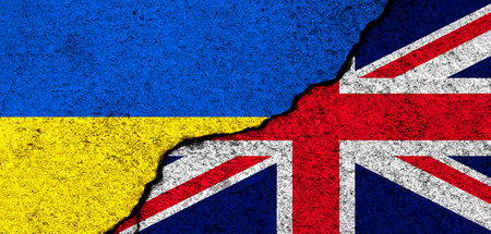 Ukraine and United Kingdom flags. Support and help, weapons and military equipment, partnership and diplomacy, humanitarian aid and donations for Ukrainian refugees photoの写真素材