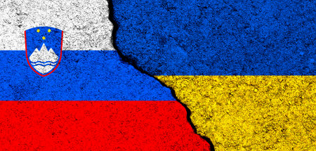 Ukraine and Slovenia flags. Support and help, weapons and military equipment, partnership and diplomacy, humanitarian aid and donations for Ukrainian refugees photoの写真素材