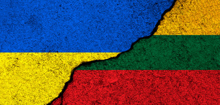 Ukraine and Lithuania flags. Support and help, weapons and military equipment, partnership and diplomacy, humanitarian aid and donations for Ukrainian refugees conceptの写真素材