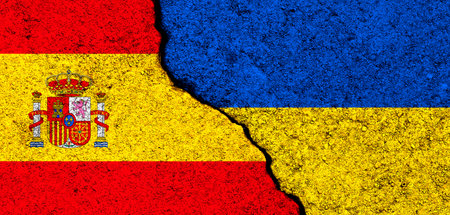 Ukraine and Spain flags. Support and help, weapons and military equipment, partnership and diplomacy, humanitarian aid and donations for Ukrainian refugees conceptの写真素材