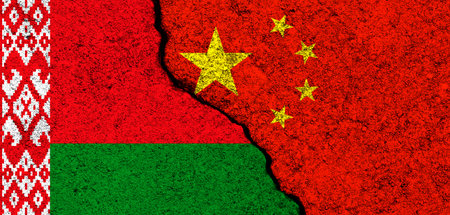 China and Belarus. Flag background. Concept of politics, economy, culture and conflicts, war. friendships and cooperation. Painted on concrete walls bannerの写真素材
