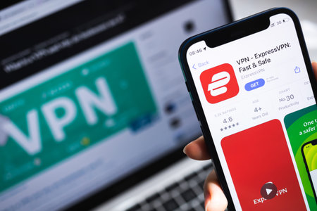 SPB, Russia - April 15, 2022: ExpressVPN app. Icon close-up. Smartphone in hand with VPN application...