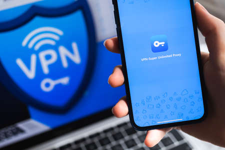 SPB, Russia - April 15, 2022: VPN Super Unlimited Proxy app. Logo close-up. Smartphone in hand with VPN application photoのeditorial素材