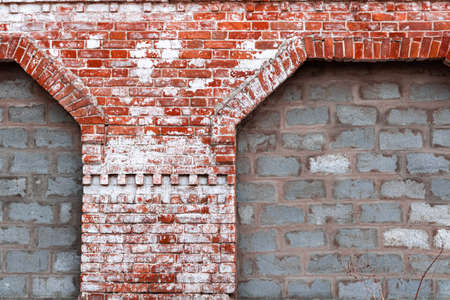 Red brick wall in white weathered paint, exterior and masonry concept backgroundの写真素材